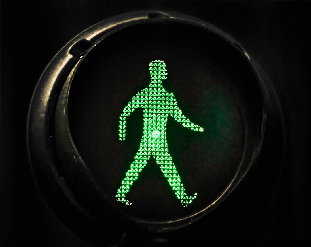 a green figure in a circle